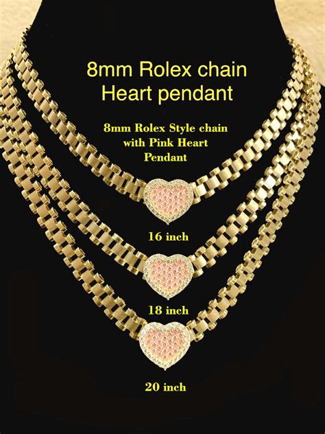 rolex chain with heart pendant.